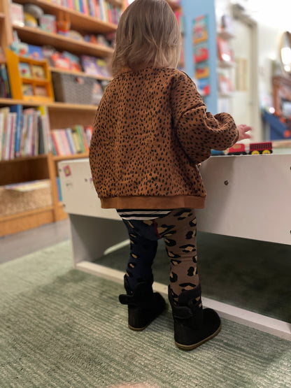 child wearing leopard leggings hansel from basel